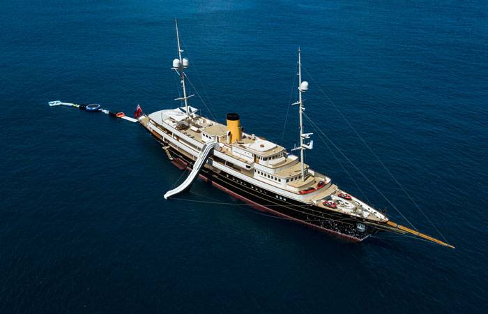 Aerial view of NERO Yacht with an inflatable slide and other inflatable toys.