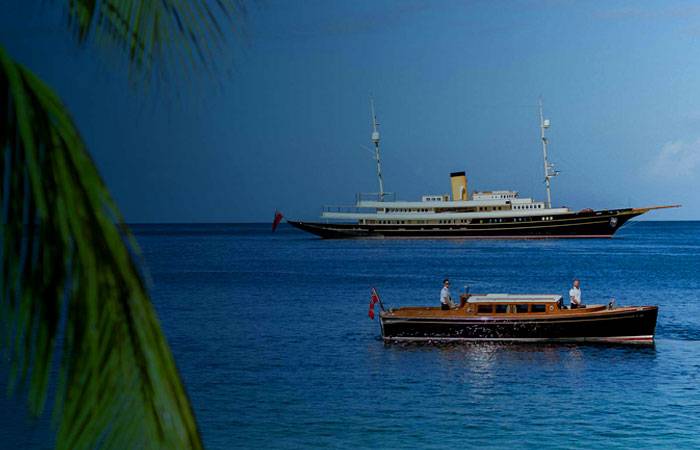 Motor Yacht Nero and her tender boat on the water